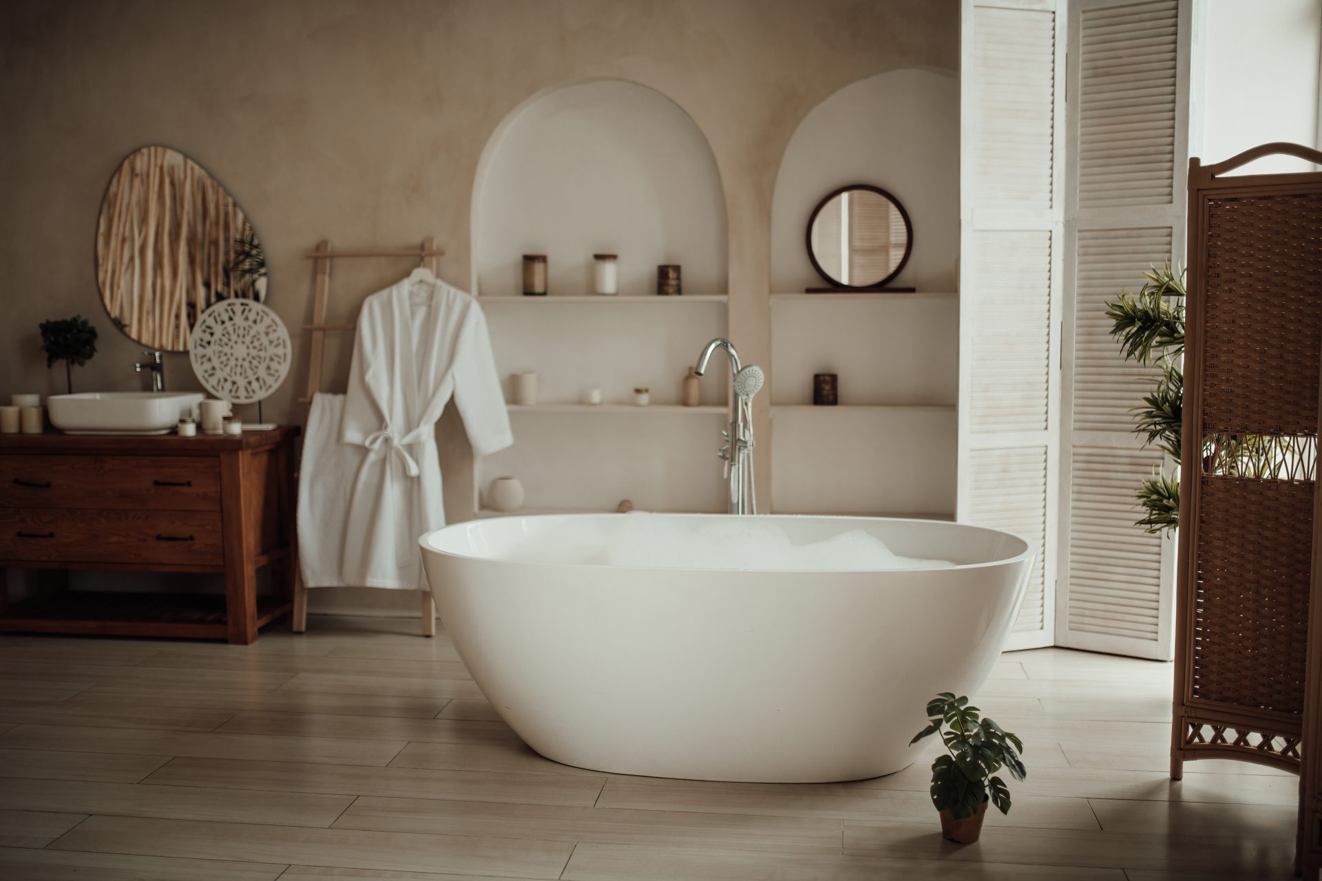 Bathroom installation with freestanding bath and fitted bathroom fixtures